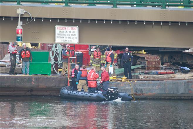 Authorities recover the body of a man identified as Robert John Silverman, 51, of Milwaukee Thursday morning in the Milwaukee River near Wisconsin Ave. The cause of his death remains undermined.
